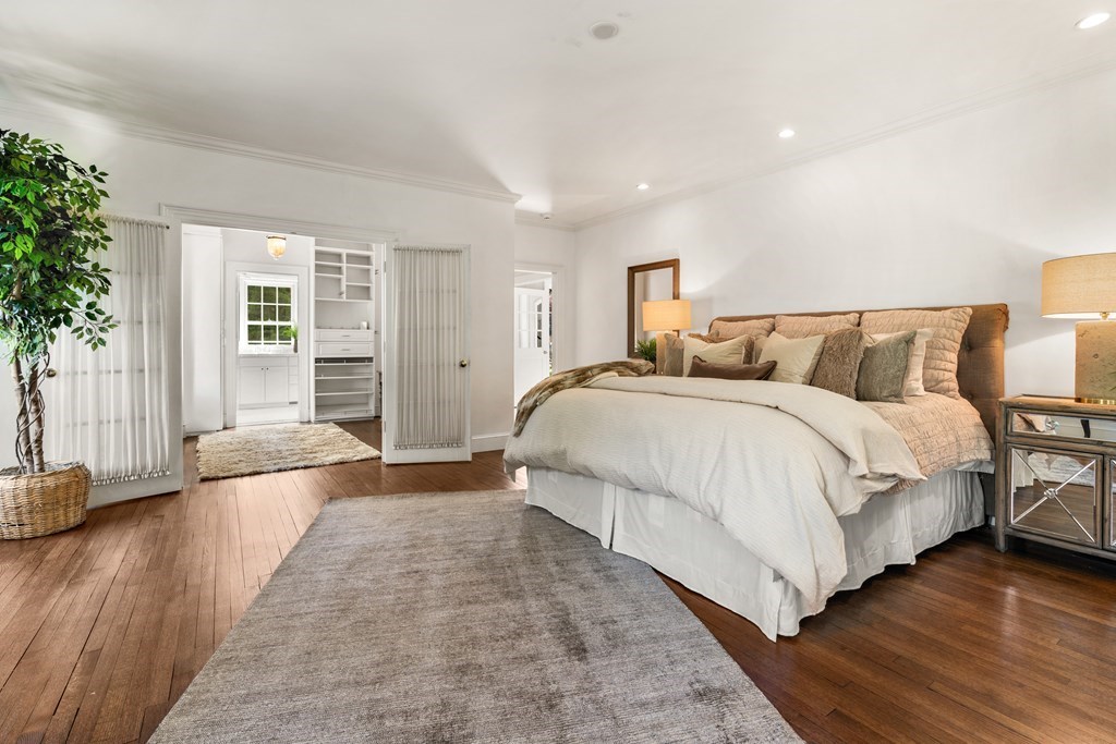 1 Rocky Ridge Road Dedham, MA 02026 - Photo 16 of 38 a spacious bedroom with a bed and a large window