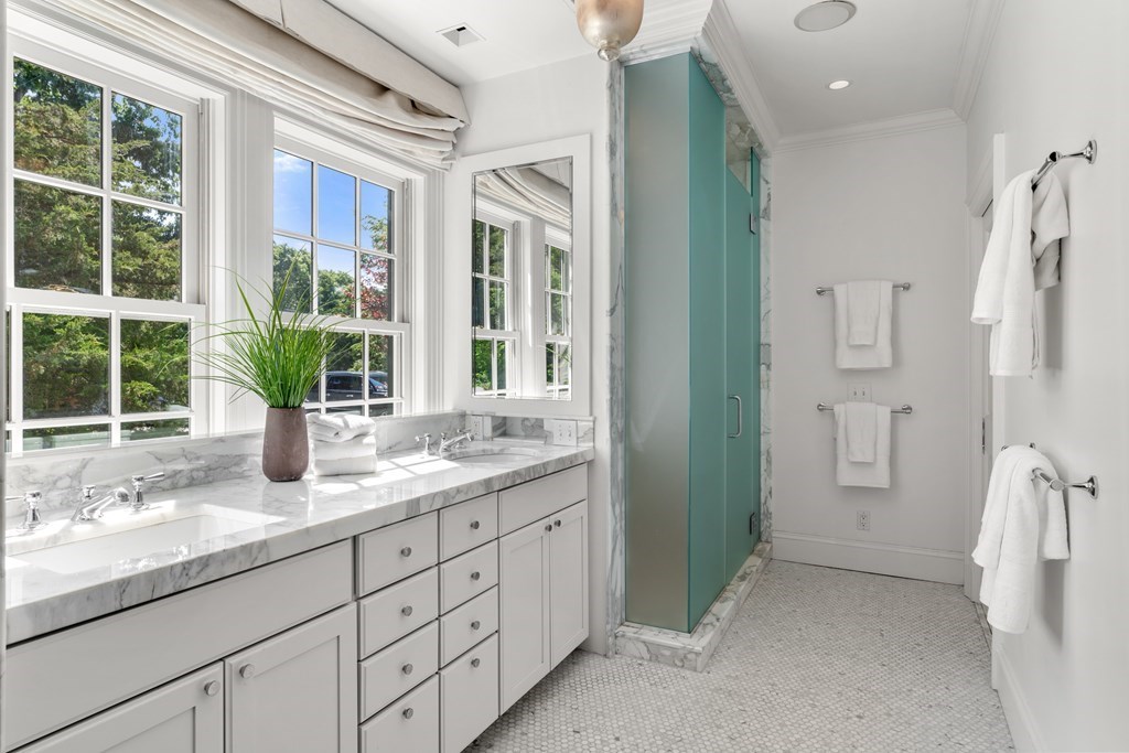 1 Rocky Ridge Road Dedham, MA 02026 - Photo 19 of 38 a bathroom with a granite countertop sink mirror next to a window