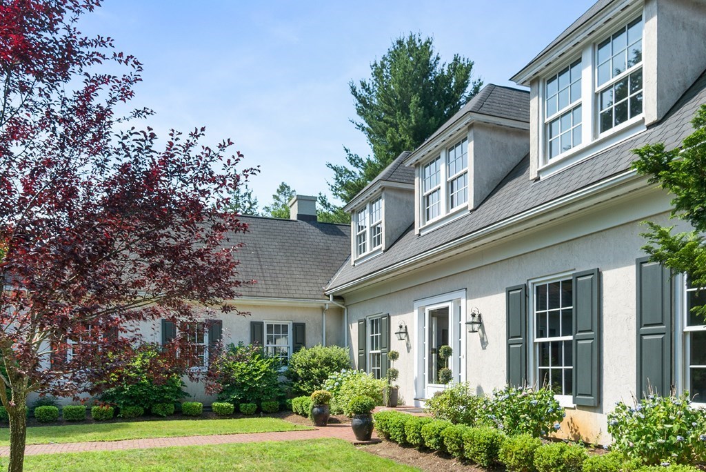 1 Rocky Ridge Road Dedham, MA 02026 - Photo 2 of 38 a front view of a building with garden