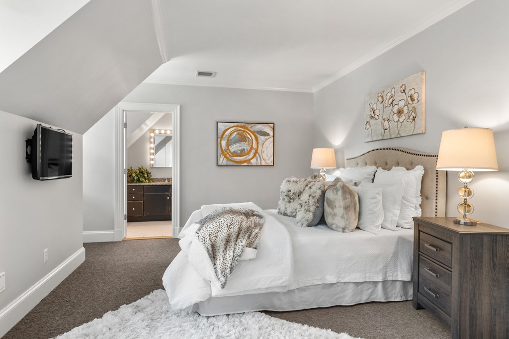 1 Rocky Ridge Road Dedham, MA 02026 - Photo 26 of 38 a bedroom with a large bed and a tv