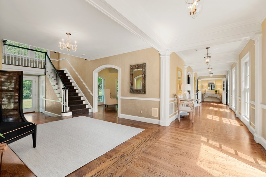 1 Rocky Ridge Road Dedham, MA 02026 - Photo 5 of 38 a living room with lots of furniture and a chandelier