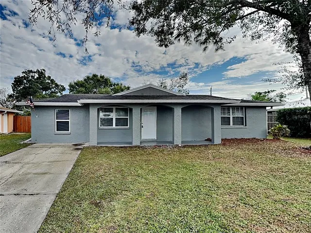 front view of a house with a yard