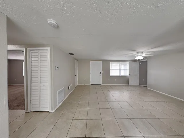 an empty room & windows in a room