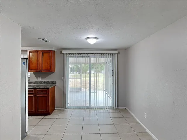 a view of a kitchen with a sink and a window