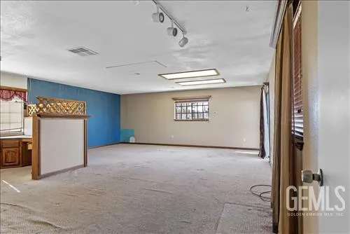 a view of walk in closet with empty room