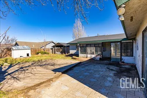 a view of a backyard of the house
