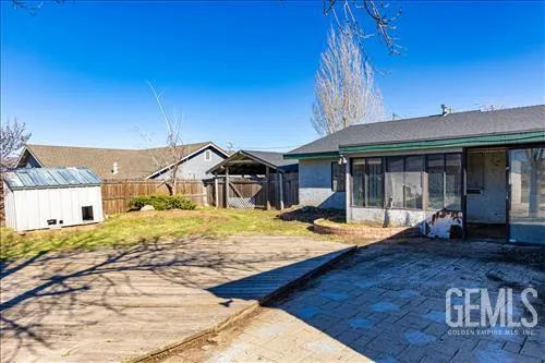 a front view of house with yard and trees