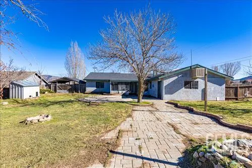 a view of empty room with wooden ceiling
