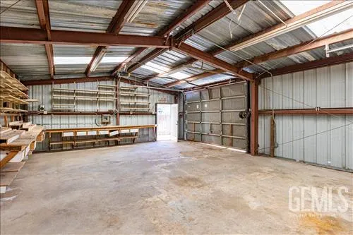 a view of a swimming pool with a patio and a yard