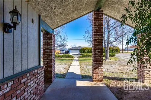 a view of a door and brick walls