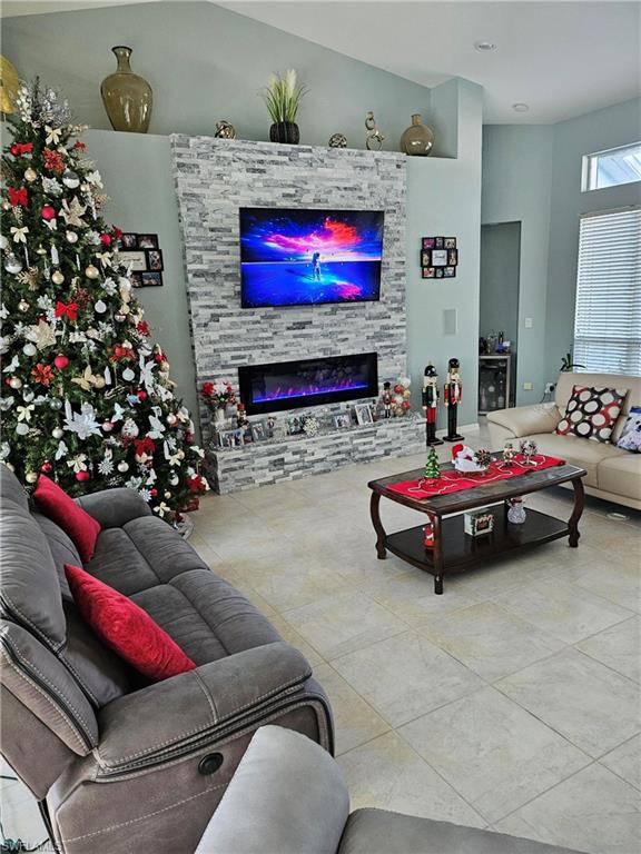 7791 Grande Pine Road Bokeelia, FL 33922 - Photo 37 of 45 a living room with furniture and a fireplace