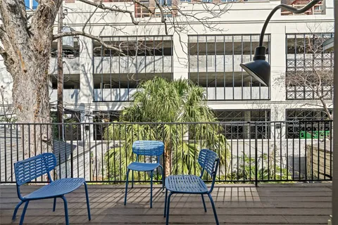 a view of a chairs and table in a patio