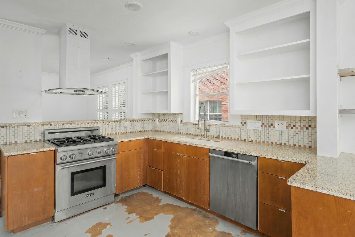 1740 Wroxton Court Houston, TX 77005 - Photo 21 of 27 a kitchen with a stove and a sink