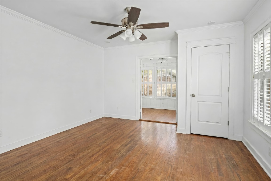 1740 Wroxton Court Houston, TX 77005 - Photo 22 of 27 wooden floor in an empty room with a window