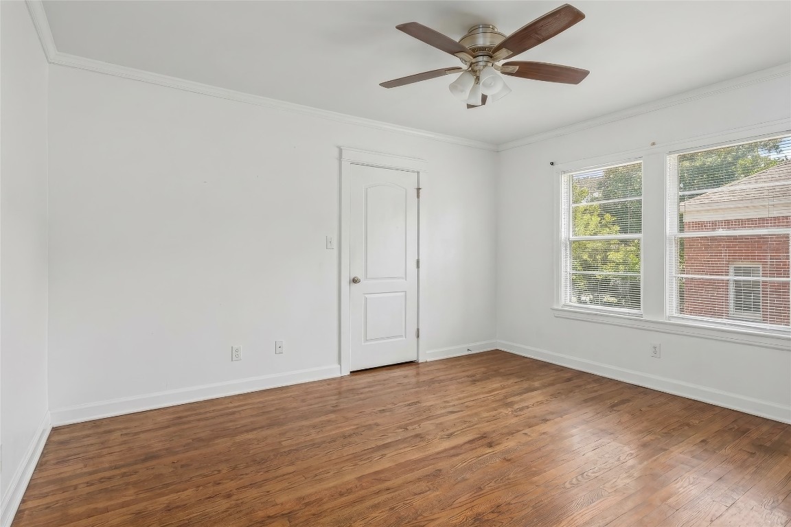 1740 Wroxton Court Houston, TX 77005 - Photo 25 of 27 wooden floor in an empty room with a window