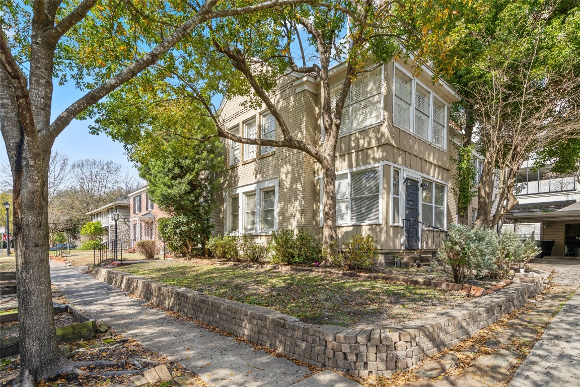 1740 Wroxton Court Houston, TX 77005 - Photo 27 of 27 a view of a road with a tree in front of it