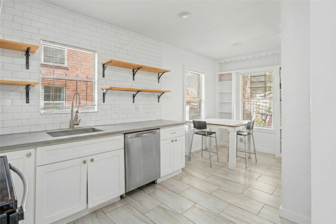 1740 Wroxton Court Houston, TX 77005 - Photo 6 of 27 a room with white cabinets and sink
