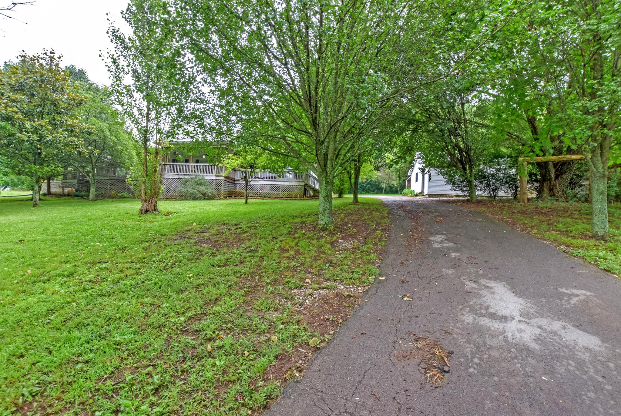 945 Turner Road Watertown, TN 37184 - Photo 3 of 30 a view of a yard with plants and trees