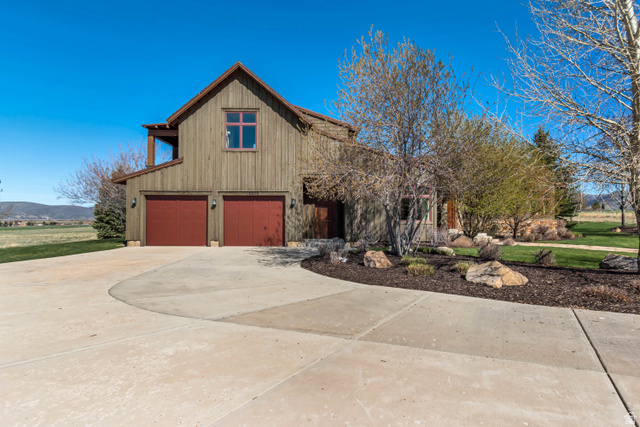2579 Splendor Valley Road Kamas, UT 84036 - Photo 13 of 87 View of front of property featuring concrete driveway, a garage, and a mountain view