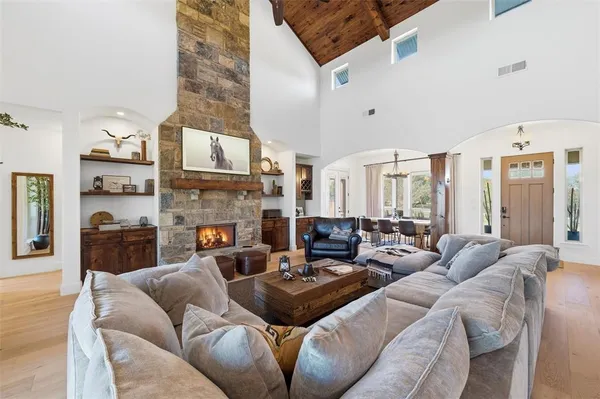 a living room with furniture fireplace and a flat screen tv