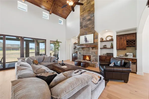 a bedroom with furniture and a fireplace