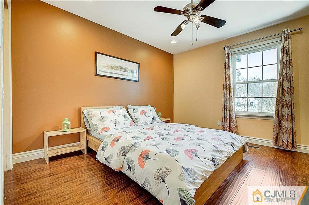 4505 Stonehedge Road Edison, NJ 08820 - Photo 17 of 25 a bedroom with a bed and a window