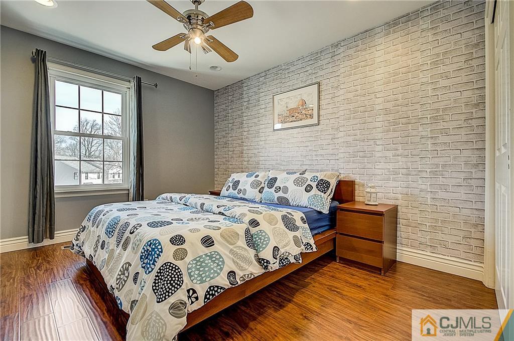 4505 Stonehedge Road Edison, NJ 08820 - Photo 19 of 25 a bedroom with a bed and window