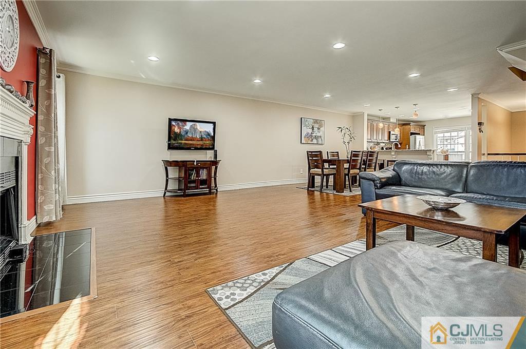 4505 Stonehedge Road Edison, NJ 08820 - Photo 3 of 25 a living room with furniture and a flat screen tv