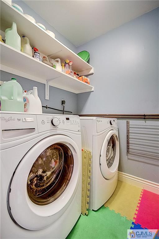 4505 Stonehedge Road Edison, NJ 08820 - Photo 23 of 25 a utility room with dryer and washer