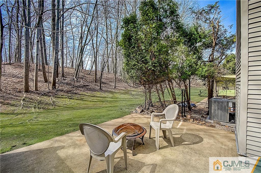 4505 Stonehedge Road Edison, NJ 08820 - Photo 25 of 25 a view of a chairs and table in the patio