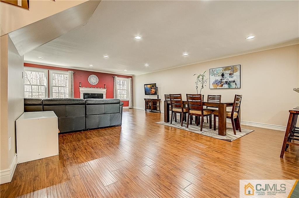 4505 Stonehedge Road Edison, NJ 08820 - Photo 6 of 25 a living room with furniture and a wooden floor