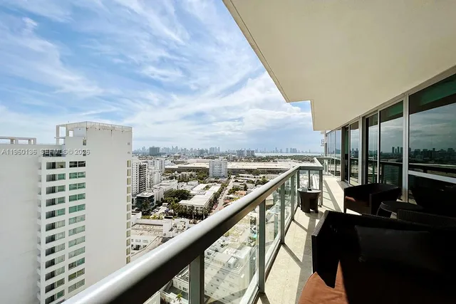 a view of balcony with furniture