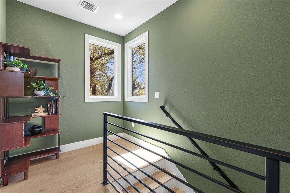 3602 Pennsylvania Avenue, Unit 2 Austin, TX 78721 - Photo 16 of 32 The upstairs landing provides a bright transitional space connecting the bedroom suites.