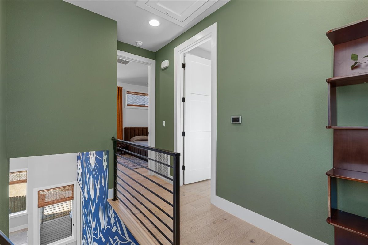 3602 Pennsylvania Avenue, Unit 2 Austin, TX 78721 - Photo 17 of 32 Natural light enhances the open feel of the staircase and landing area.