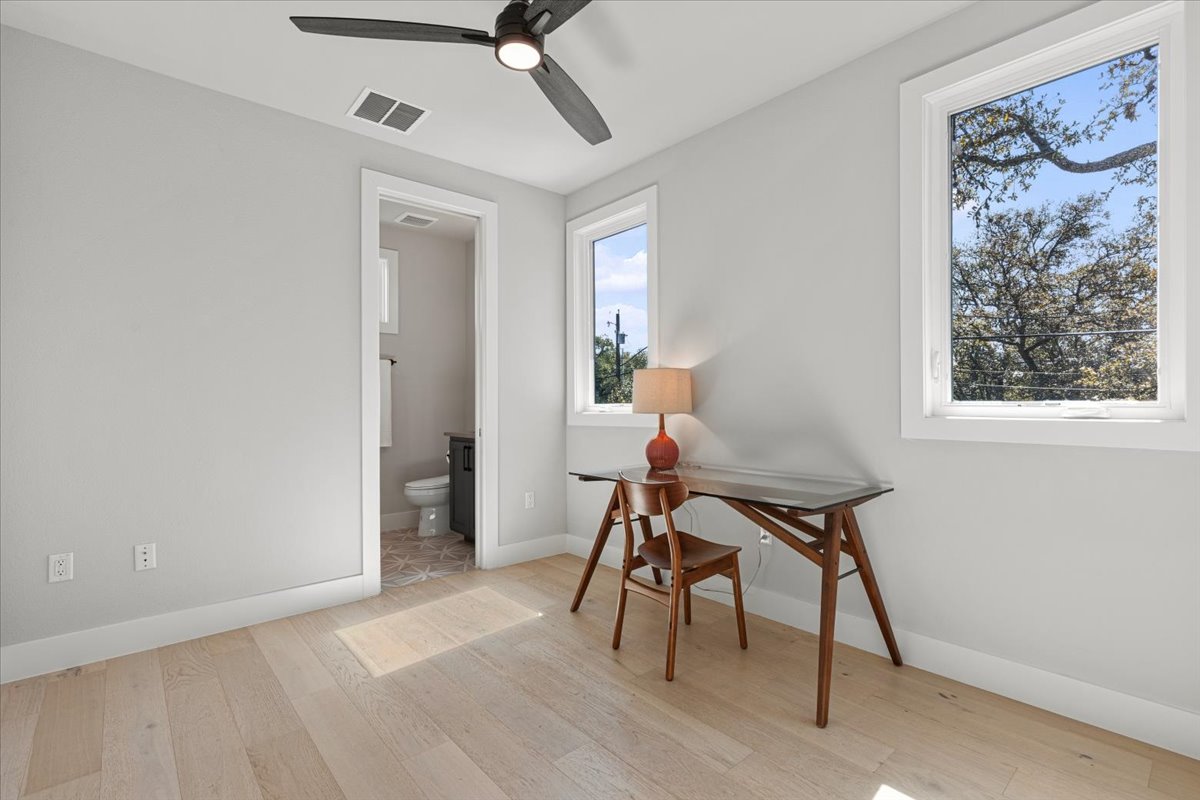 3602 Pennsylvania Avenue, Unit 2 Austin, TX 78721 - Photo 18 of 32 The guest bedroom offers a comfortable and versatile space for visitors or a home office.