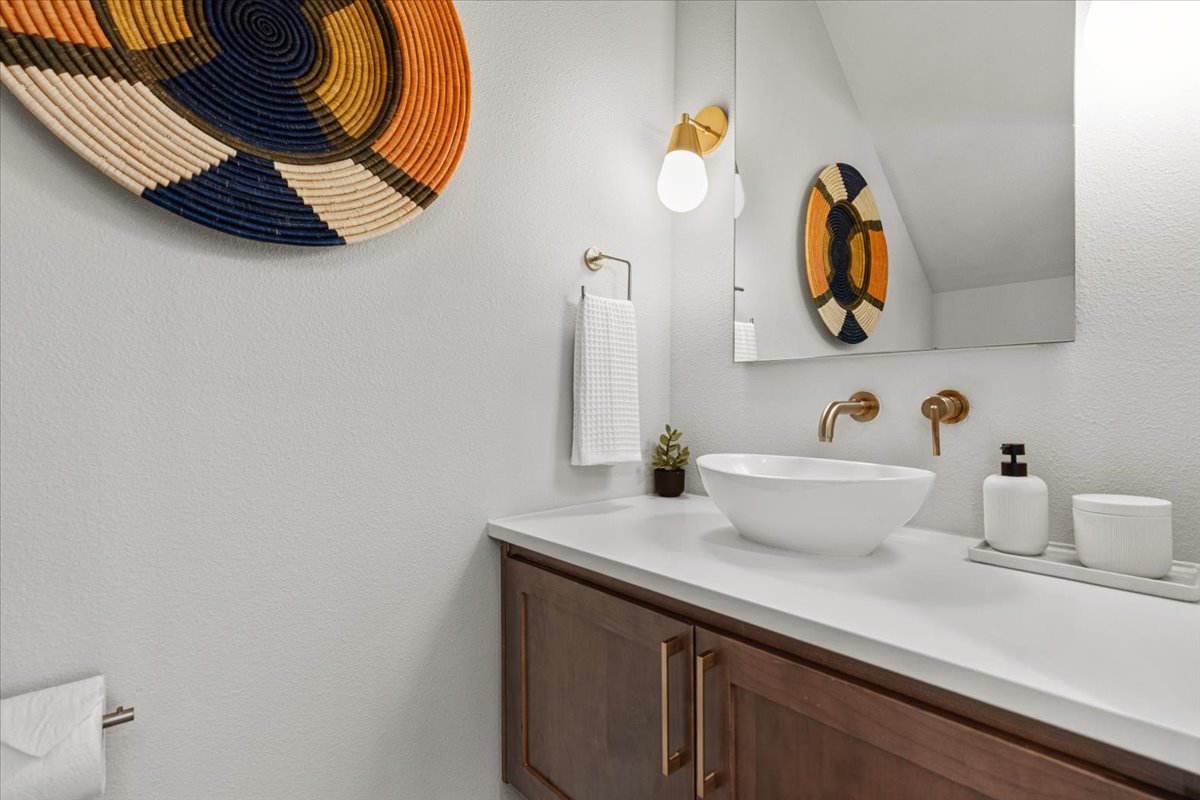 3602 Pennsylvania Avenue, Unit 2 Austin, TX 78721 - Photo 22 of 32 The main-floor powder bath provides added convenience for guests.