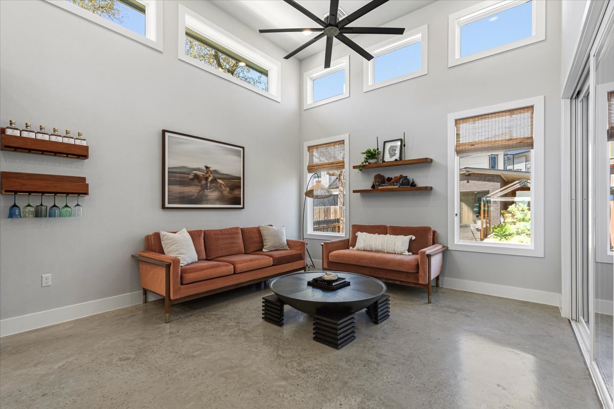 3602 Pennsylvania Avenue, Unit 2 Austin, TX 78721 - Photo 8 of 32 Polished concrete flooring adds a sleek, modern touch to the open-concept living space.
