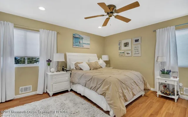 a spacious bedroom with a bed and a window