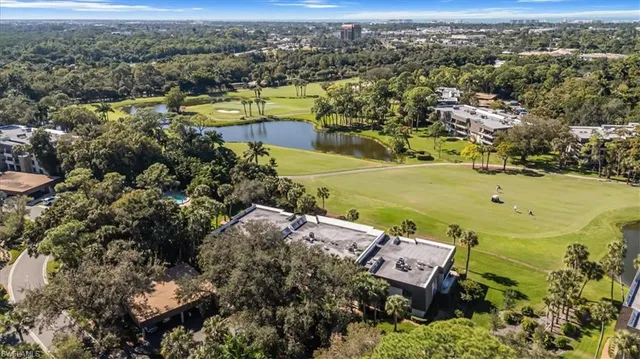 an aerial view of a city with ocean view