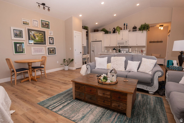 745 East 885 North Beaver, UT 84713 - Photo 12 of 50 Living area featuring light wood-style flooring, lofted ceiling, and recessed lighting