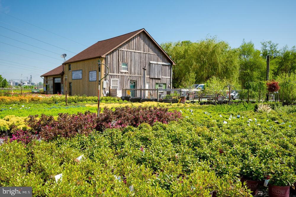 430 Limestone Road Oxford, PA 19363 - Photo 11 of 20 a view of a house with a big yard and potted plants