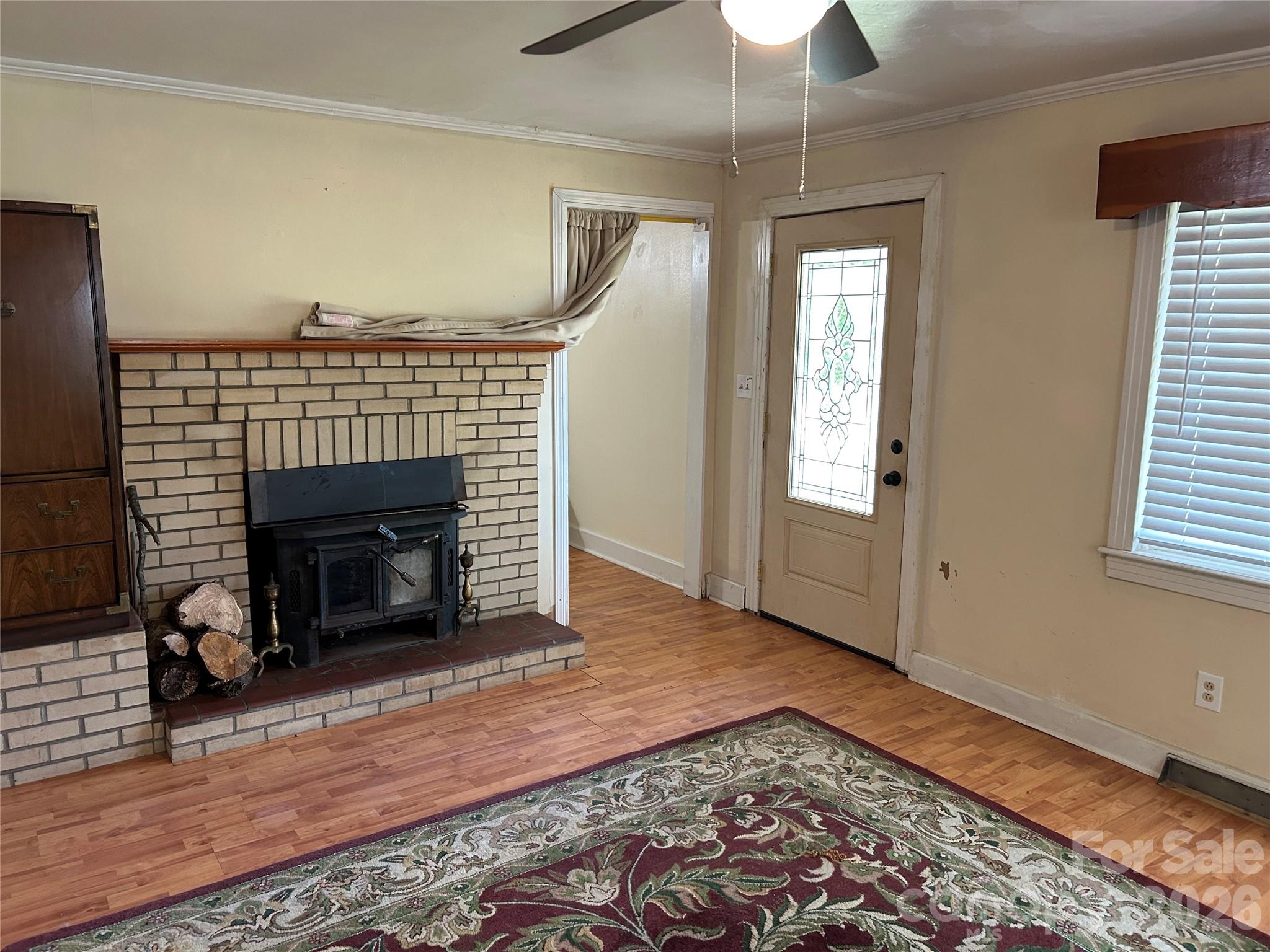 2307 Harris Henrietta Road Forest City, NC 28043 - Photo 19 of 31 a view of a livingroom with a fireplace and window