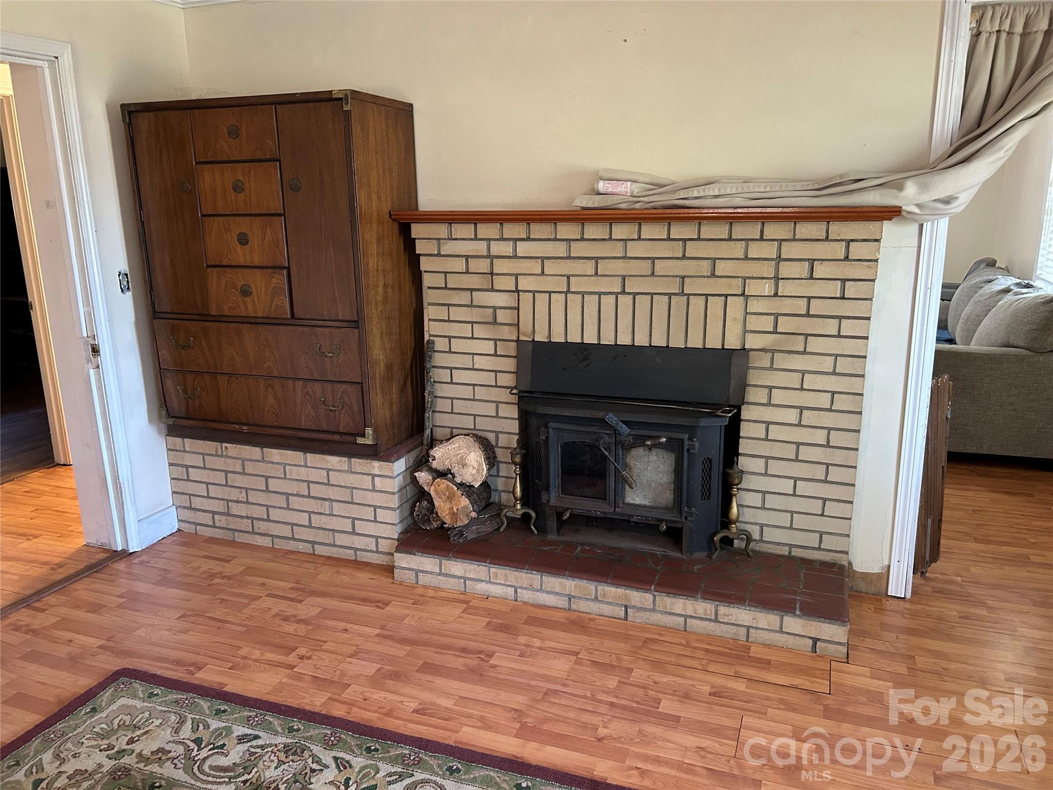 2307 Harris Henrietta Road Forest City, NC 28043 - Photo 20 of 31 a view of a livingroom with a fireplace and window