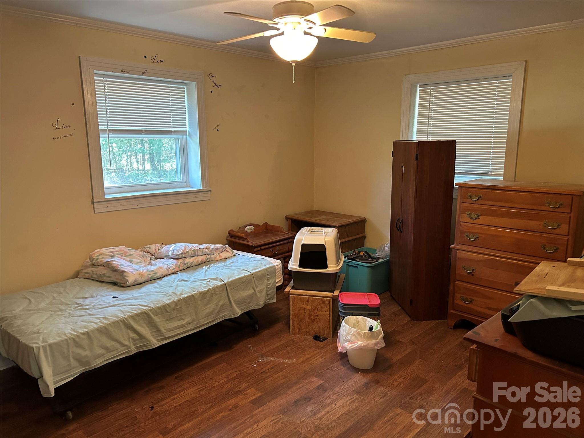 2307 Harris Henrietta Road Forest City, NC 28043 - Photo 21 of 31 a bedroom with a bed and wooden floor