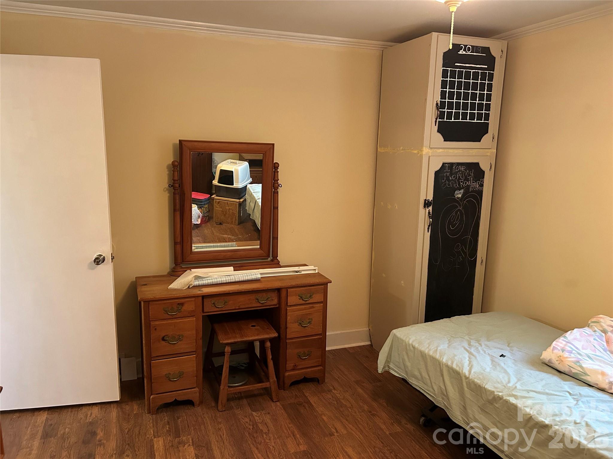 2307 Harris Henrietta Road Forest City, NC 28043 - Photo 23 of 31 a bedroom with a bed and a dresser