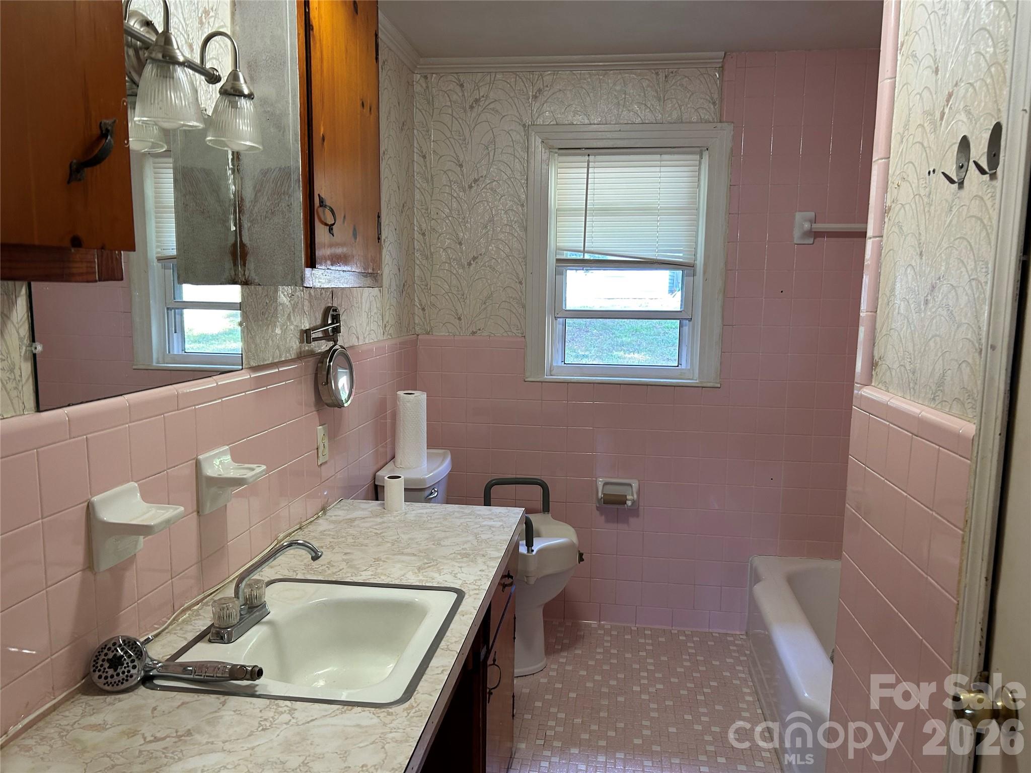 2307 Harris Henrietta Road Forest City, NC 28043 - Photo 26 of 31 a bathroom with a sink a toilet and a tub