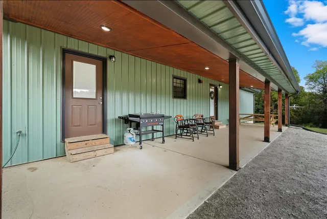 a kitchen with stainless steel appliances granite countertop a wooden cabinets and a counter top space
