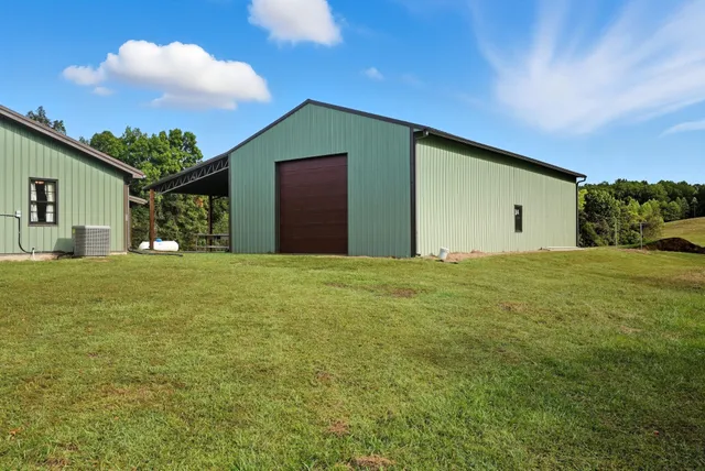 a spacious bathroom with a granite countertop sink and a large mirror