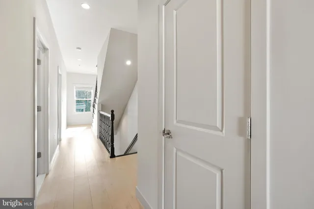 a view of a hallway with staircase