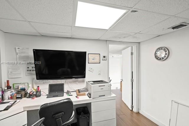 8th Street Miami, FL 33130 - Photo 24 of 38 a work place with a couch and a flat screen tv